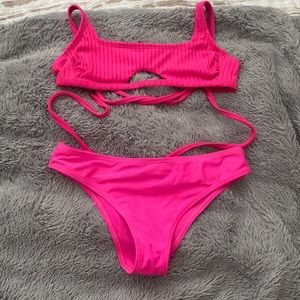 This is a two-piece, extra small top and small bottom set, bright pink